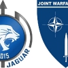 I loghi dell'Ex Trident Jaguar 15 e del Joint Warfare Centre (JWC)